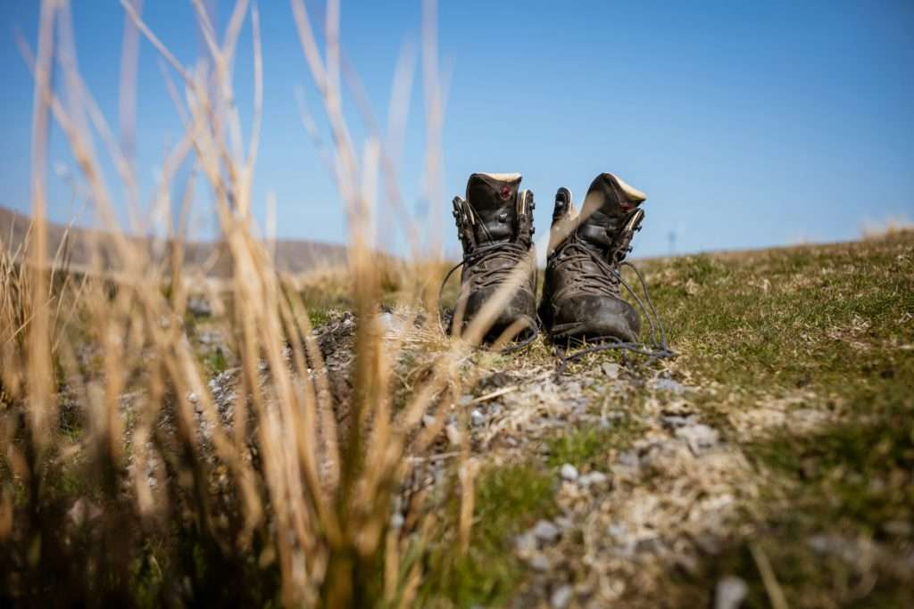 boots sitting on top of grass UK hiking holiday