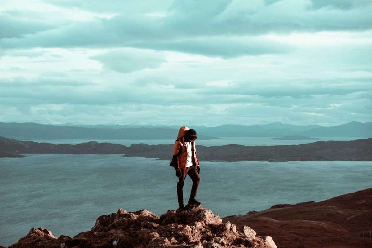 person standing on a hill UK hiking holiday