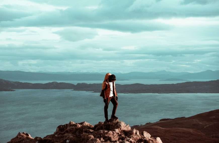 person standing on a hill UK hiking holiday